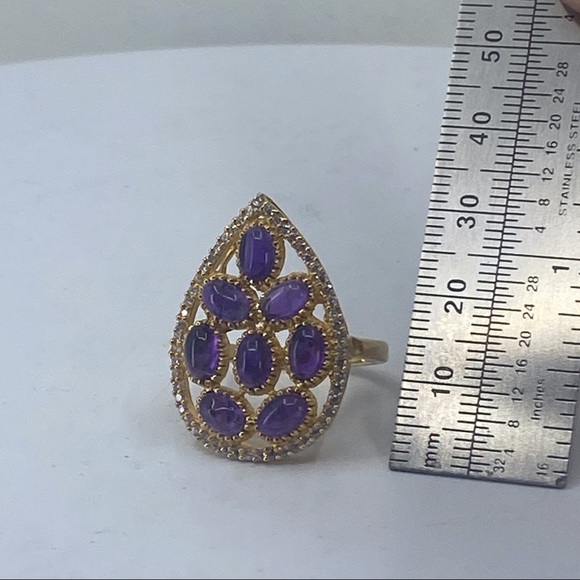 Sterling silver ring with gold tone finish. It is accented with 8 oval stones. - Picture 5 of 5